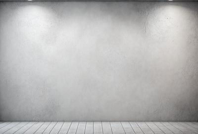 The primary subject of the image is a large, empty white wall. The setting is a room with a wooden floor. The visual style is a photo, and the colors and mood are predominantly white, giving the image a clean and minimalist appearance.