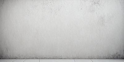 The primary subject of the image is a white wall with a dirty texture. The setting is a room with a dirty wall, and the visual style is a photo. The colors and mood of the image are predominantly white, with a slightly dirty and worn appearance.