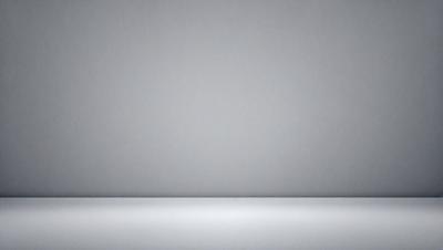 The primary subject of the image is a large, empty white wall. The setting is a plain, white room with no other objects or decorations visible. The visual style is a simple, clean, and minimalist design. The colors and mood of the image are predominantly white, creating a sense of emptiness and simplicity.