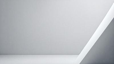 The primary subject of the image is a white wall. The setting is a plain, white room with a white wall. The visual style is a photo, and the colors and mood are predominantly white, giving the image a clean and minimalist appearance.