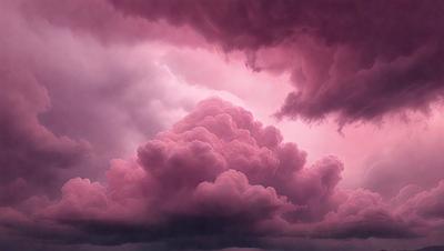 The primary subject of the image is a large, pink cloud with a purple hue. The cloud is surrounded by a dark, stormy sky. The setting is a cloudy, pink and purple sky, which creates a dramatic and moody atmosphere. The visual style of the image is a photo, capturing the beauty of the cloud formation. The colors and mood of the image are predominantly pink and purple, with a hint of darkness from the stormy sky.