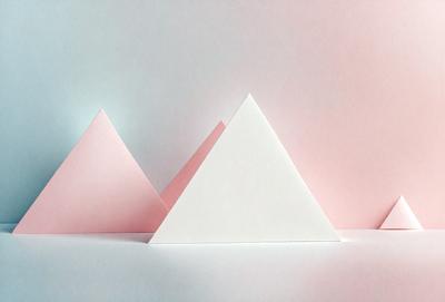 The primary subject of the image is a white triangle, which is the main object in the scene. The setting is a white background, and the visual style is a photo. The colors in the image are predominantly white and pink, creating a calm and soothing atmosphere.