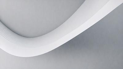 The primary subject of the image is a white curved pipe or tube. The setting is a gray background, which provides a clean and minimalist appearance. The visual style is a close-up of the pipe, emphasizing its shape and texture. The colors and mood of the image are predominantly neutral, with the white pipe being the main focal point.