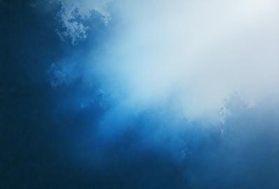 The primary subject of the image is a blue sky with clouds. The setting is a vast, open space, and the visual style is a photo. The dominant colors are blue and white, creating a serene and peaceful atmosphere.