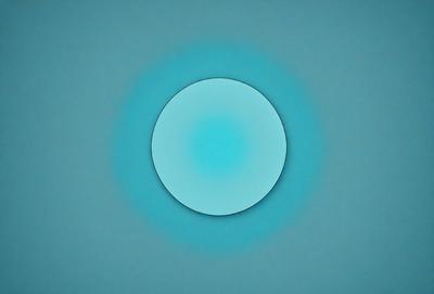 The primary subject of the image is a blue circle, which is the main object, scene, or focus of the image. The setting or background is a blue surface, which adds to the overall atmosphere of the image. The visual style of the image is a photo, as it captures a real-life scene. The colors and mood of the image are predominantly blue, creating a calm and serene atmosphere.
