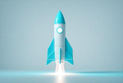 The primary subject of the image is a blue rocket, which is the main object, scene, or focus of the image. The setting/background is a white surface, and the visual style is a digital art or illustration. The colors and mood of the image are predominantly blue, giving it a calm and serene atmosphere.