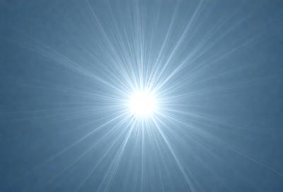 The primary subject of the image is a bright, white sun. The sun is the main object in the scene, and it is surrounded by a blue sky. The visual style of the image is a photo, capturing the sun's rays as they spread out into the sky. The colors in the image are predominantly blue and white, creating a calm and serene atmosphere.