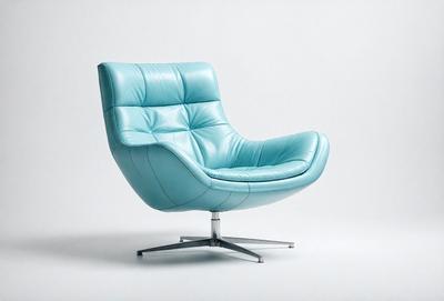 The primary subject of the image is a blue chair with a leather seat. The chair is placed on a white surface, which serves as the setting or background. The visual style of the image is a photo, capturing the chair in its natural environment. The dominant colors in the image are blue and white, creating a clean and modern atmosphere.