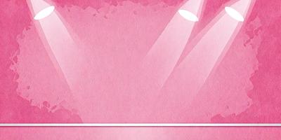 The primary subject of the image is a pink background with a light shining on it. The setting is a stage or a performance area, as indicated by the lighting. The visual style is a combination of a photo and a digital art, creating a unique and eye-catching effect. The colors and mood of the image are predominantly pink, which gives it a warm and inviting atmosphere.