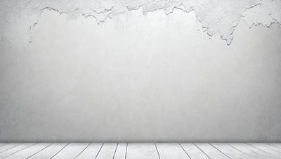 The primary subject of the image is a white wall with a large crack in it. The setting is a room with a wooden floor. The visual style is a photo, and the colors and mood are predominantly white, giving the image a clean and minimalist appearance.