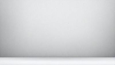 The primary subject of the image is a white wall. The setting is a room with a white wall, and the visual style is a photo. The colors and mood of the image are predominantly white, creating a clean and minimalist atmosphere.