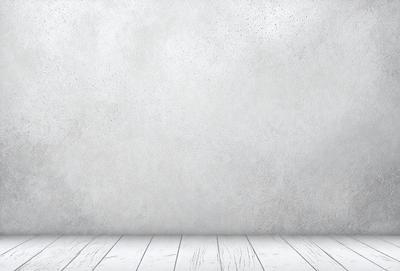 The primary subject of the image is a white wall with a wooden floor. The setting is a room with a white wall and a wooden floor. The visual style is a photo of a white wall with a wooden floor. The colors and mood are predominantly white, giving the image a clean and minimalist appearance.