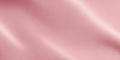 The primary subject of the image is a pink fabric, which is the main object, scene, or focus of the image. The setting or background is a pink sheet, and the visual style is a photo. The colors and mood of the image are predominantly pink, creating a warm and inviting atmosphere.
