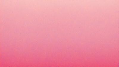 The primary subject of the image is a large, pink, textured surface. The setting is a pink background, which creates a warm and inviting atmosphere. The visual style is a combination of a photo and a digital art, as the pink surface appears to be a blend of the two. The colors and mood of the image are predominantly pink, giving it a soft and calming appearance.
