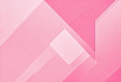 The primary subject of the image is a pink paper with a geometric pattern. The setting is a pink background, and the visual style is a patterned paper. The colors and mood of the image are predominantly pink, creating a warm and inviting atmosphere.
