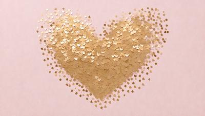 The primary subject of the image is a heart-shaped arrangement of gold glitter or confetti. The heart is placed on a pink background, which adds a warm and romantic touch to the scene. The visual style of the image is a combination of digital art and illustration, as the heart is composed of individual glitter pieces that are carefully arranged to form the heart shape. The colors and mood of the image are predominantly warm and inviting, with the gold glitter and pink background creating a sense of love