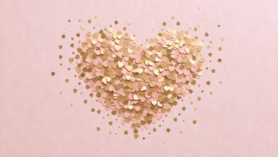 The primary subject of the image is a heart-shaped arrangement of gold and pink confetti. The heart is made up of various gold and pink confetti pieces, creating a visually appealing and festive display. The setting is a pink background, which complements the colors of the confetti. The visual style of the image is a combination of digital art and illustration, as the heart is skillfully crafted to resemble a heart shape. The colors and mood of the image are warm and inviting,