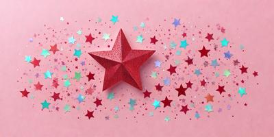 The primary subject of the image is a red star, which is the main object, scene, or focus of the image. The setting is a pink background, and the visual style is a photo. The colors and mood of the image are predominantly pink and red, creating a warm and festive atmosphere.