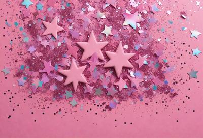 The primary subject of the image is a pink background with a pattern of stars. The setting is a pink background with a pattern of stars. The visual style is a photo. The colors and mood are predominantly pink, creating a warm and inviting atmosphere.