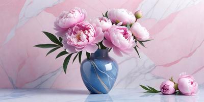 The primary subject of the image is a vase filled with pink flowers. The vase is placed on a table, and the flowers are arranged in a visually appealing manner. The setting is a room with a pink wall, which adds a warm and inviting atmosphere to the scene. The visual style of the image is a realistic representation of the vase and flowers, capturing the beauty of the pink flowers in the blue vase. The colors and mood of the image are predominantly pink and warm
