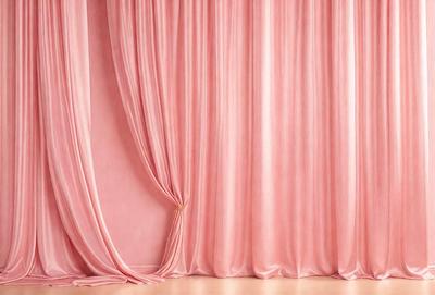 The primary subject of the image is a pink curtain. The setting is a stage or a theater, with a pink background. The visual style is a photo, and the colors and mood are predominantly pink, creating a warm and inviting atmosphere.