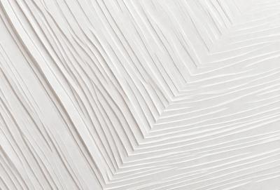 The primary subject of the image is a white wall with a pattern of folded paper or a white paper sculpture. The setting is a room with a white background, which creates a clean and minimalist atmosphere. The visual style is a combination of digital art and illustration, as the paper sculpture appears to be a digital creation. The colors and mood are predominantly white, giving the scene a calm and serene feel.