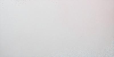 The primary subject of the image is a white canvas with a pattern of glittering, sparkling dots. The setting is a white background, and the visual style appears to be a digital art or illustration. The colors and mood of the image are predominantly white, with the glittering dots adding a touch of sparkle and visual interest.