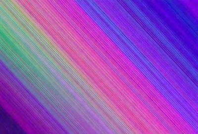 The primary subject of the image is a colorful, rainbow-like pattern. The setting is a colorful background, which adds to the vibrant atmosphere of the scene. The visual style of the image is a combination of photo and digital art, creating a unique and eye-catching design. The dominant colors in the image are a mix of purple, pink, and blue, giving the scene a lively and cheerful mood.