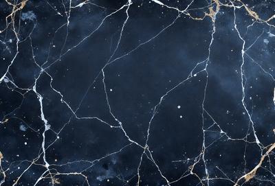 The primary subject of the image is a black and white photo of a marble wall with a blue tint. The setting is a dark room, and the visual style is a close-up of the marble wall. The colors and mood of the image are predominantly dark and moody, with the blue tint adding a touch of coolness to the overall atmosphere.