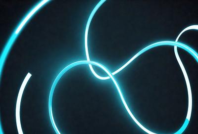 The primary subject of the image is a blue light, which appears to be a neon light or a blue light source. The light is shining on a dark background, creating a striking contrast. The visual style of the image is a close-up of the light source, emphasizing its vibrant color and unique appearance. The colors and mood of the image are predominantly blue, with a slightly mysterious and captivating atmosphere.