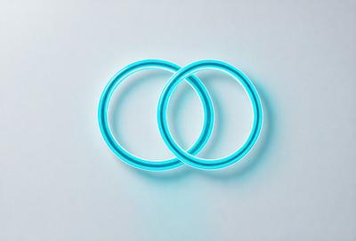 The primary subject of the image is a pair of blue rings. The setting is a white background, which provides a clean and minimalist appearance. The visual style is a digital art, as the rings are depicted as neon-colored and glowing. The dominant colors are blue and white, creating a sense of unity and harmony.