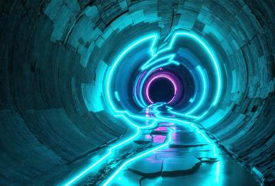 The primary subject of the image is a tunnel with a blue light illuminating it. The tunnel appears to be made of stone and has a futuristic, neon-lit atmosphere. The setting is a dark, underground environment, and the visual style is a combination of photo and digital art. The dominant colors are blue and purple, creating a unique and captivating mood.