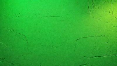 The primary subject of the image is a green wall with a texture that resembles a brick wall. The setting is a room with a green background, and the visual style appears to be a photo. The dominant colors in the image are green, and the overall atmosphere is calm and serene.