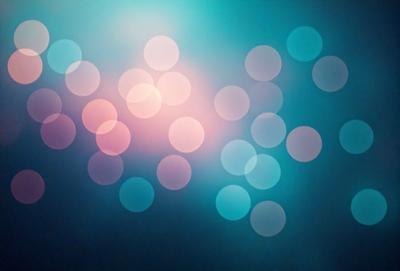 The primary subject of the image is a blue background with a pattern of white circles. The setting appears to be a dark room, possibly a nightclub or a darkened room for an artistic effect. The visual style of the image is a combination of a photo and digital art, creating a unique and eye-catching pattern. The dominant colors in the image are blue and white, with the white circles standing out against the dark blue background. The overall atmosphere of the image is one of mystery and intrigue, as the viewer is drawn