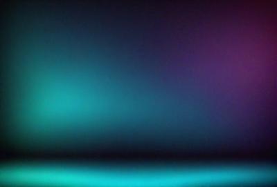 The primary subject of the image is a purple wall. The setting is a dark room with a purple wall, and the visual style is a photo. The dominant colors are purple and blue, creating a calm and serene atmosphere.