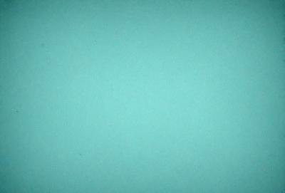 The primary subject of the image is a large, empty, and dark blue sky. The setting is a vast, open space with no visible landmarks or objects. The visual style is a realistic representation of the sky, with no indication of digital art or illustration. The colors and mood of the image are predominantly dark and moody, with the blue sky serving as the main focal point.