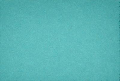 The primary subject of the image is a large, blue, textured surface. The setting is a room with a blue carpet, and the visual style is a close-up of the carpet. The colors and mood of the image are predominantly blue, creating a calm and serene atmosphere.