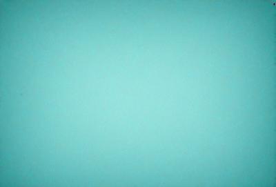 The primary subject of the image is a large, bright blue wall. The setting is a room with a blue background, and the visual style is a photo. The dominant colors are blue and white, creating a calm and serene atmosphere.