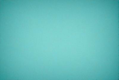 The primary subject of the image is a large, empty, and bright blue wall. The setting is a room with a blue background, and the visual style is a photo. The dominant colors are blue and white, creating a calm and serene atmosphere.