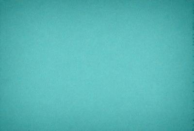 The primary subject of the image is a large, bright blue wall. The setting is a room with a blue background, which creates a vibrant and lively atmosphere. The visual style is a close-up of the blue wall, emphasizing its color and texture. The dominant colors are blue and green, with the blue wall being the most prominent feature in the scene.