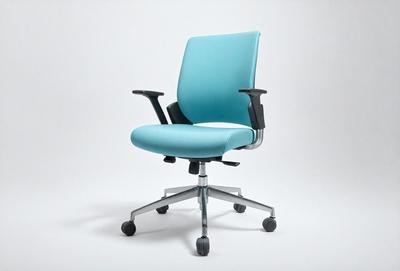 The primary subject of the image is a blue office chair. The chair is placed on a white surface, which serves as the setting or background. The visual style of the image is a photo, capturing the chair in its natural environment. The dominant colors in the image are blue and white, creating a clean and modern atmosphere.