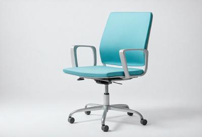 The primary subject of the image is a blue office chair with silver legs. The chair is positioned on a white surface, which serves as the setting or background. The visual style of the image is a photo, capturing the chair in its natural environment. The dominant colors in the image are blue and white, creating a clean and modern atmosphere.