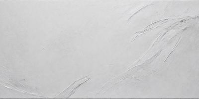The primary subject of the image is a white wall with a textured surface. The setting is a room with a white background. The visual style is a close-up of the wall, showcasing its texture and appearance. The colors and mood of the image are predominantly white, giving it a clean and minimalist appearance.