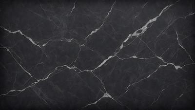 The primary subject of the image is a black marble countertop. The setting is a kitchen, with the countertop being the main focus of the scene. The visual style is a close-up of the marble countertop, showcasing its texture and pattern. The colors and mood of the image are predominantly dark, with the black marble providing a striking contrast against the darker background.