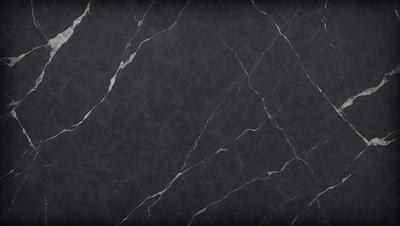 The primary subject of the image is a black marble countertop. The setting is a kitchen, with the countertop being the main focus of the scene. The visual style is a close-up of the marble countertop, showcasing its texture and details. The colors and mood of the image are dark and moody, with the black marble countertop being the dominant color.