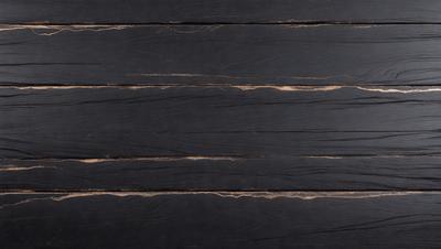 The primary subject of the image is a wooden surface, possibly a table or a wall, with a black background. The setting appears to be a room with a wooden floor. The visual style of the image is a close-up of the wooden surface, showcasing its texture and details. The colors in the image are predominantly black, giving it a dark and moody atmosphere.