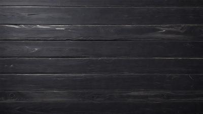 The primary subject of the image is a wooden wall. The setting is a black wooden wall, which serves as the background. The visual style is a photo, capturing the wooden texture and grain. The dominant colors are black and brown, creating a moody atmosphere.