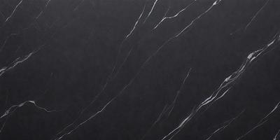The primary subject of the image is a black marble countertop. The setting is a kitchen, with the countertop being the main focus of the scene. The visual style is a close-up of the marble countertop, showcasing its texture and appearance. The colors and mood of the image are predominantly dark, with the black marble countertop being the main source of contrast and visual interest.