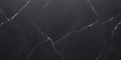 The primary subject of the image is a close-up of a marble countertop. The setting is a kitchen, with the marble countertop being the main focus of the scene. The visual style is a photo, showcasing the natural texture and beauty of the marble. The colors and mood of the image are predominantly black and white, giving it a classic and elegant appearance.