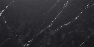 The primary subject of the image is a marble countertop. The setting is a kitchen, with the countertop being the main focus of the scene. The visual style is a close-up of the marble countertop, showcasing its texture and details. The colors and mood of the image are predominantly black, giving it a sleek and modern appearance.